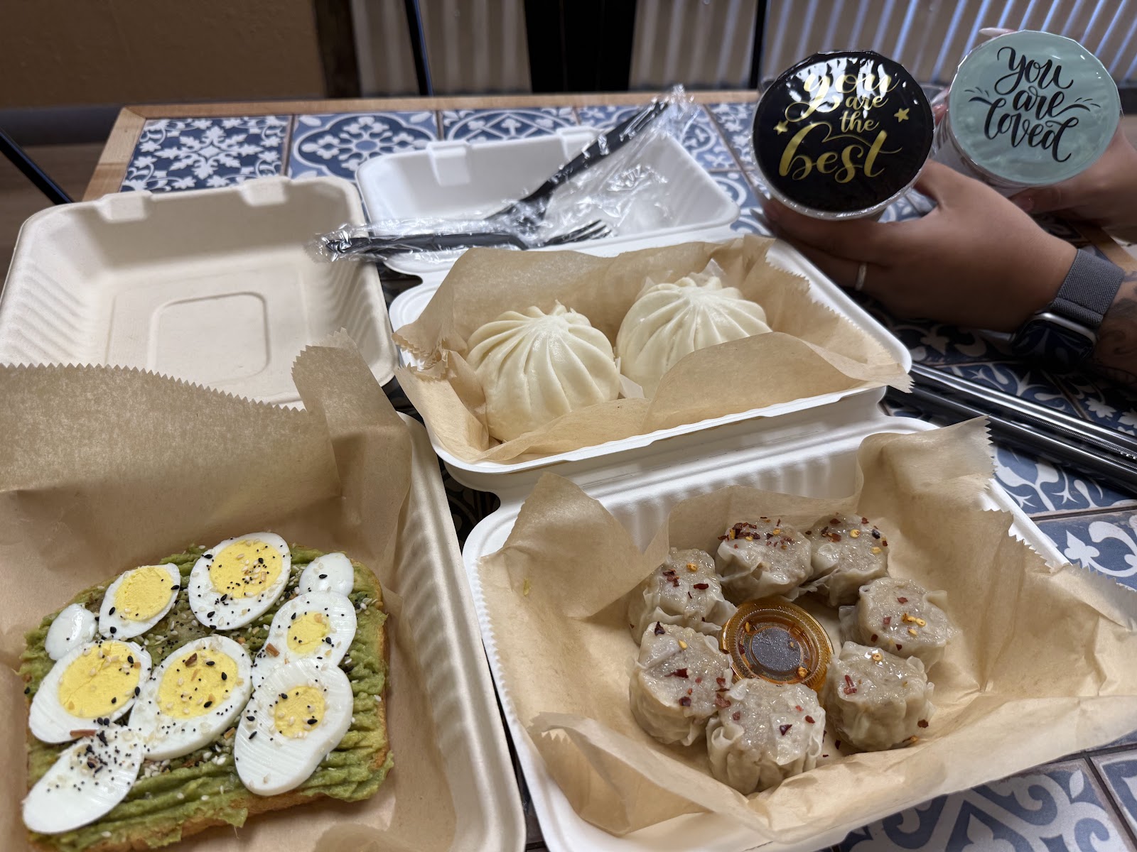 Steamed bao, pork shumai dumplings, and avocado toast